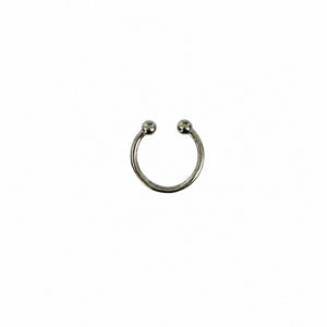 Silver nose ring on a white background